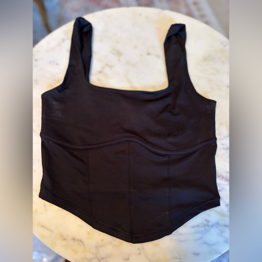 Black sports bra size XS. Live in the moment.